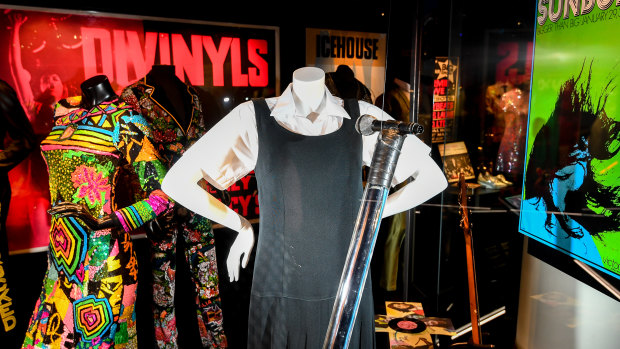 Amphlett's signature tunic and fluoro mic stand on display in the Australian Music Vault.