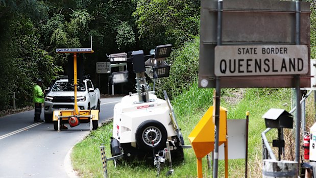 A car is stopped at Tomewin, on the border of New South Wales and Queensland.