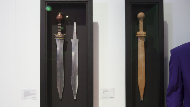 Russell Crowe's aluminium prop sword, spare blade and wooden training sword from the film <em>Gladiator</em>.