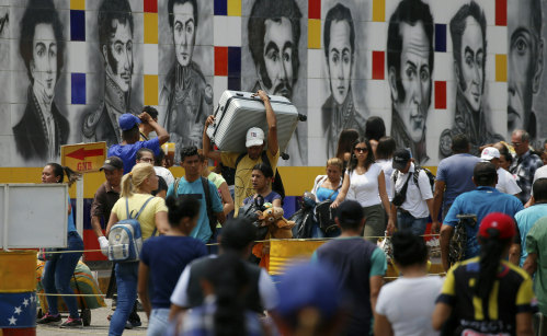 Venezuelans return home through San Antonio del Tachira, a crossing used by locals who shop across the border in Cucuta, Colombia.