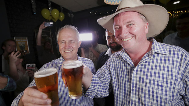 Prime Minister Malcolm Turnbull and New England candidate Barnaby Joyce celebrate at Barnaby Joyce's election night party at the Southgate Inn in Tamworth during the New England by-election on Saturday 2 December 2017.