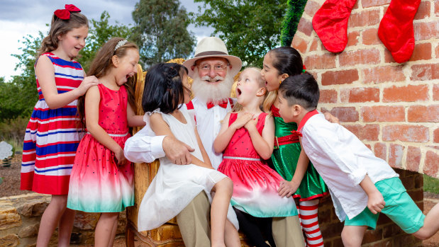Cliff White, centre, as the self-proclaimed Santa Claus in <i>Miracle on 34th Street Canberra</i>.