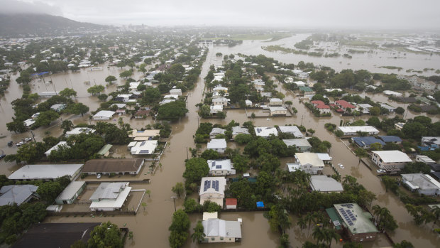 Houses are inundated in Townsville on Monday.