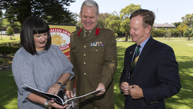 President of Australian Army Rugby Union Brigadier Ben James and Rugby Australia chief executive Raelene Castle chat with former Wallaby Bob Brown at Victoria Barracks in Sydney.