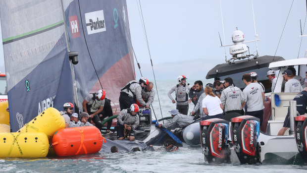 American Magic crew try to stop the boat sinking after it capsized in race two against Prada Luna Rosa 1during the 2021 PRADA Cup Round Robins on Auckland Harbour on January 17, 2021 in Auckland, New Zealand. 