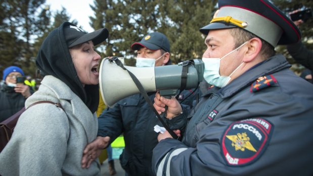 A woman argues with police officer during a protest in support of jailed opposition leader Alexei Navalny in Ulan-Ude, the regional capital of Buryatia, a region near the Russia-Mongolia border.