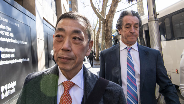 Ernest Wong (centre) arrives at the NSW Independent Commission Against Corruption inquiry.