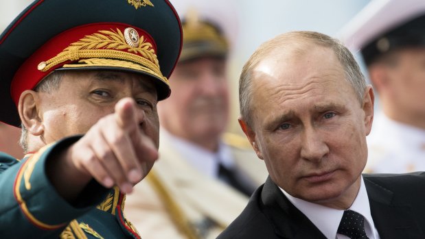 Russian President Vladimir Putin with his Defence Minister Sergei Shoigu. 