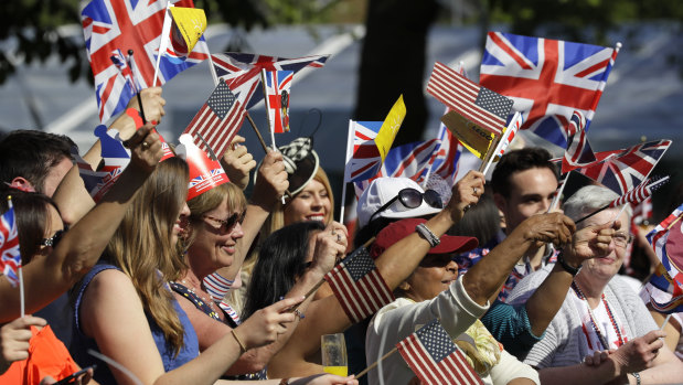 Well-wishers wave British and American flags prior to the wedding ceremony.
