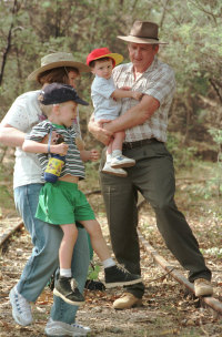 Tim Fischer with his wife Judy Brewer and sons Harrison and Dominic on the old Wagga to Tumbarumba railway line, 1998. 