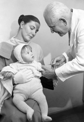 A young girl receives a polio vaccination at the Department of Public Health on Macquarie Street in Sydney on 30 July 1959.