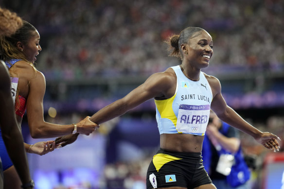 Julien Alfred (right) of St Lucia, after the women’s 200 metres final,  with Gabrielle Thomas of the US.