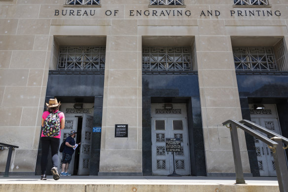 James Kane and Barbie Agostini enter the US Treasury’s Bureau of Engraving and Printing in Washington with an estimated $US50,000 to $US70,000 in waterlogged $US100 bills.