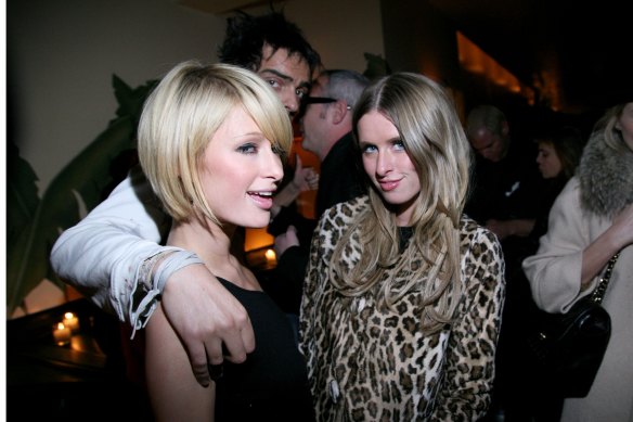 Paris Hilton, Andy Valmorbida and Nicky Hilton at an art show in New York in 2009.