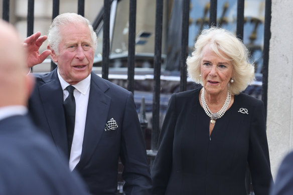 King Charles III and Camilla, Queen Consort view floral tributes at Buckingham Palace.