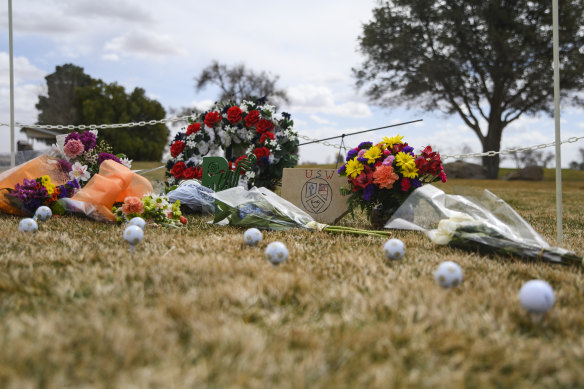 A memorial erected in honour of the University of the Southwest golf team’s car wreck is seen on Friday AEDT at the Rockwind Community Links in Hobbs, New Mexico. 