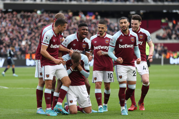 Andriy Yarmolenko falls to his knees after scoring for West Ham.