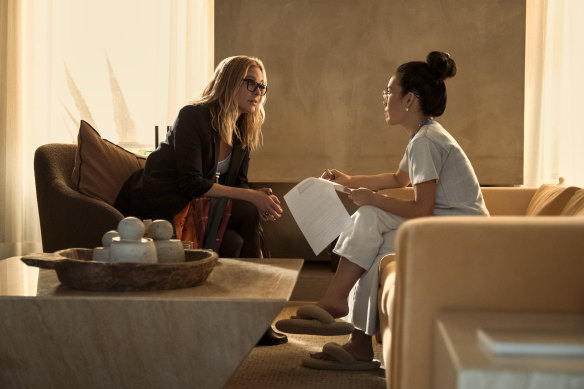 Maria Bello (left) is terrific as Jordan, a mogul dallying with the business owned by Amy (Ali Wong), in Beef.