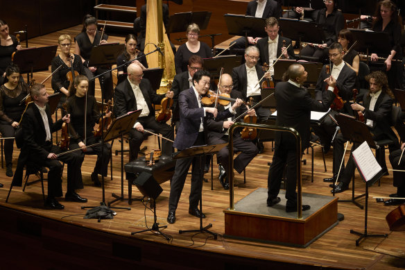 Soloist Soloist Lu Siqing and conductor Tan Dun in a performance of Nine at Hamer Hall in Melbourne. 