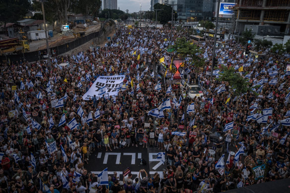 Israeli protesters gather at a rally marking nine months since the start of the Israel–Hamas war, in Tel Aviv.