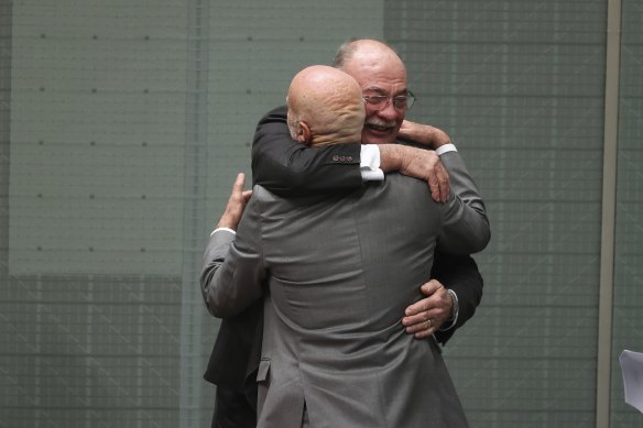 LNP MP Warren Entsch embracing retiring Labor MP Warren Snowdon.