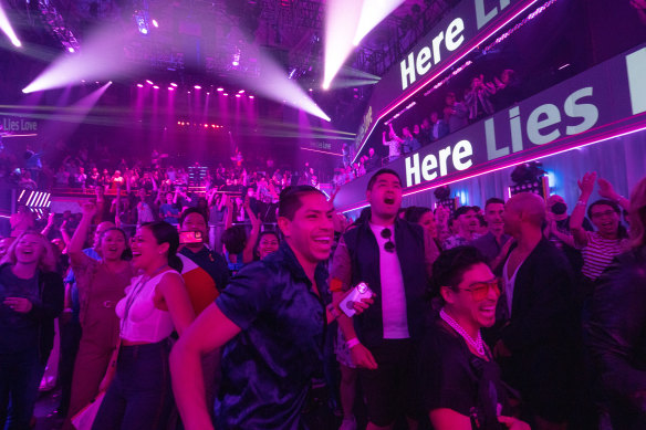 Audience members double as dance club patrons in David Byrne’s Here Lies Love. 