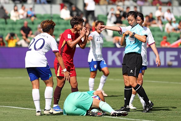 Wang Shuang is shown a yellow card during China’s win over Taiwan in Perth.