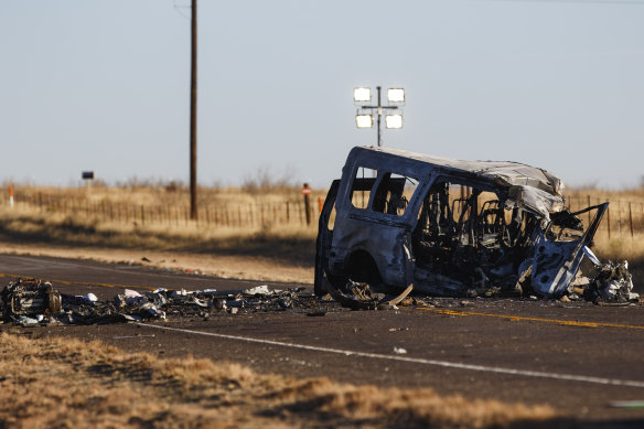 The damage bus sits on the side of the road at the scene of a fatal car wreck early on Wednesday in the US. 