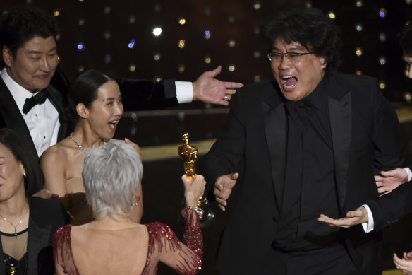 Excitement as Bong Joon-ho, right, wins best picture at the Academy Awards for Parasite last year.
