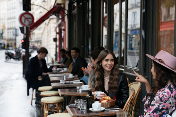 Emily living her best croissant-eating life.