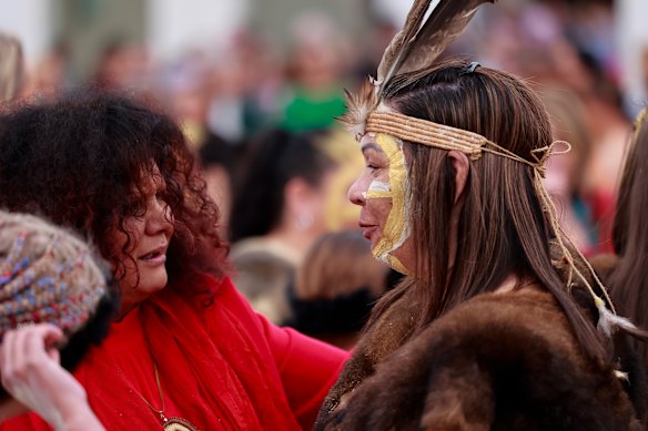 Malarndirri McCarthy speaks to a dancer at a smoking ceremony this week in Canberra. 