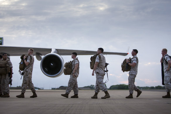 US Marines embark an aircraft at RAAF Base Darwin.