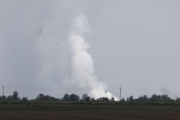 Smoke rises from the explosion site.