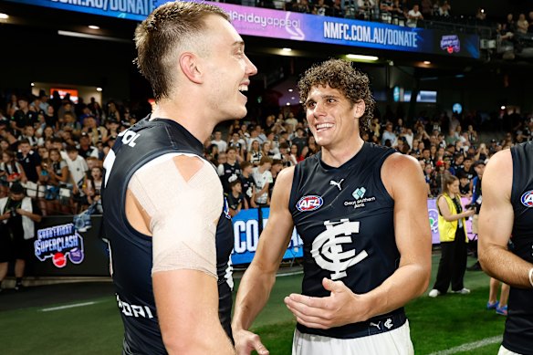 Blues skipper Patrick Cripps and superstar forward Charlie Curnow share a laugh after their side’s big win.