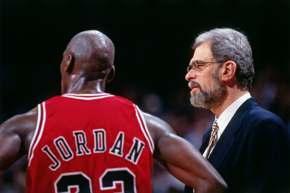 Coach Phil Jackson talks to Jordan in 1996.