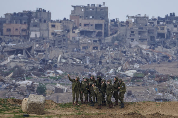 Israeli female soldiers take a souvenir photo on the Gaza Strip border, southern Israel.