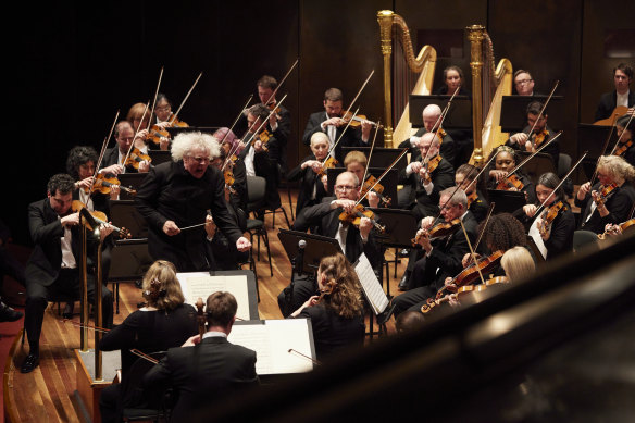 Sir Simon Rattle conducts The London Symphony Orchestra as they perform Mahler 7 in Melbourne on Saturday.