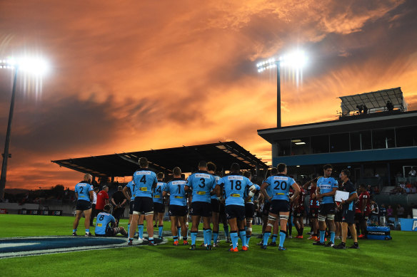 The Waratahs commiserate after their season-opening loss to the Crusaders.