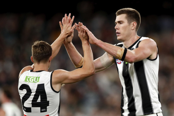Mason Cox (right) is standing up for Collingwood.