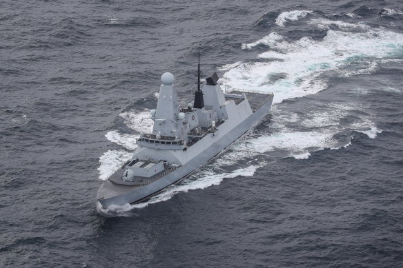 A Royal Navy warship has shot down a suspected attack drone targeting commercial ships in the Red Sea, officials said. 