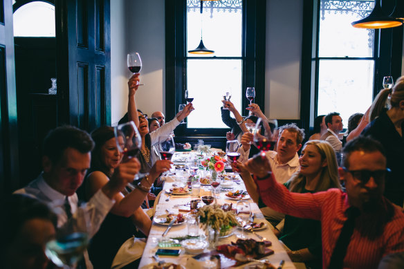 Diners toasting at Epocha.