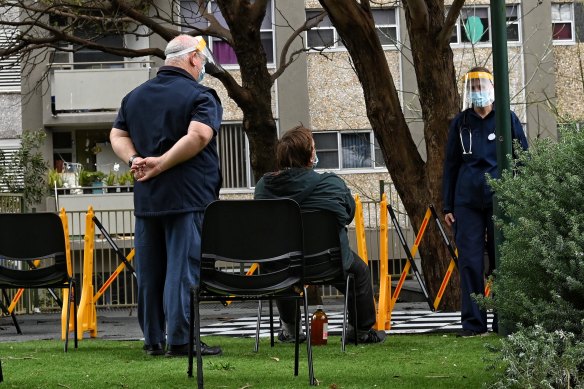 Health authorities set up a COVID-19 testing clinic outside the Redfern towers.