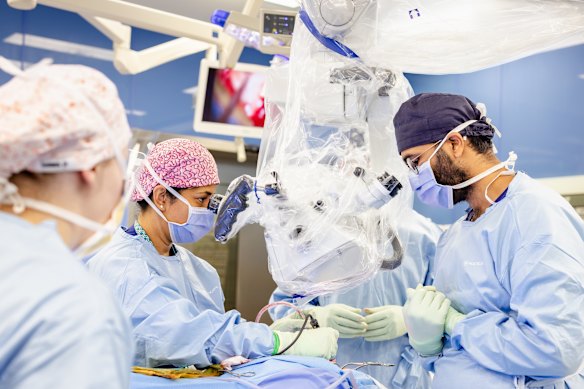 Dr Snigdha Saha and the microscope during a live brain surgery procedure at Perth Children’s Hospital.