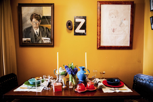 The dining room once shared by David McDermott and Peter McGough features a portrait of McDermott, left, and a drawing of McGough by his ex-lover.