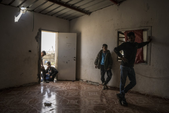 Holes in the roof and floor at the home of Amina al-Hasoni, a seven-year-old girl who was injured by missile shrapnel.