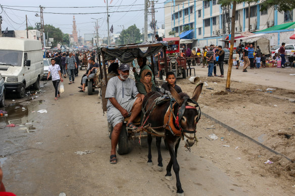 Palestinians use animal-drawn carts to travel during a fuel shortage in Khan Younis, in southern Gaza.
