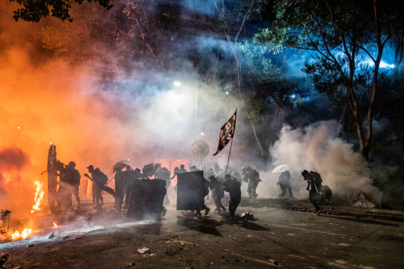 Protesters and riot police clash at the Chinese University of Hong Kong on November 12.