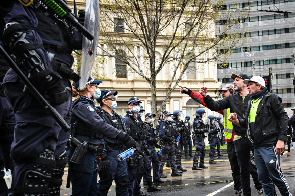 Police and the CFMEU were confronted on Monday by a high-vis clad crowd angry at vaccine mandates.