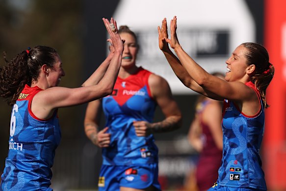 Melbourne Demons celebrate their emphatic win over Brisbane 
