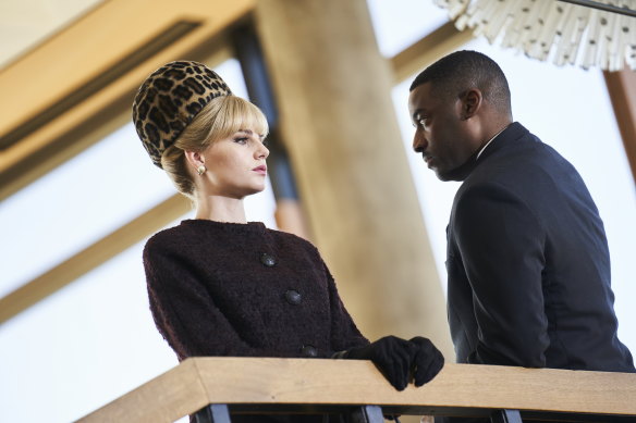 Lucy Boynton as Jean and Ashley Thomas as Maddox in a scene in The Ipcress File.